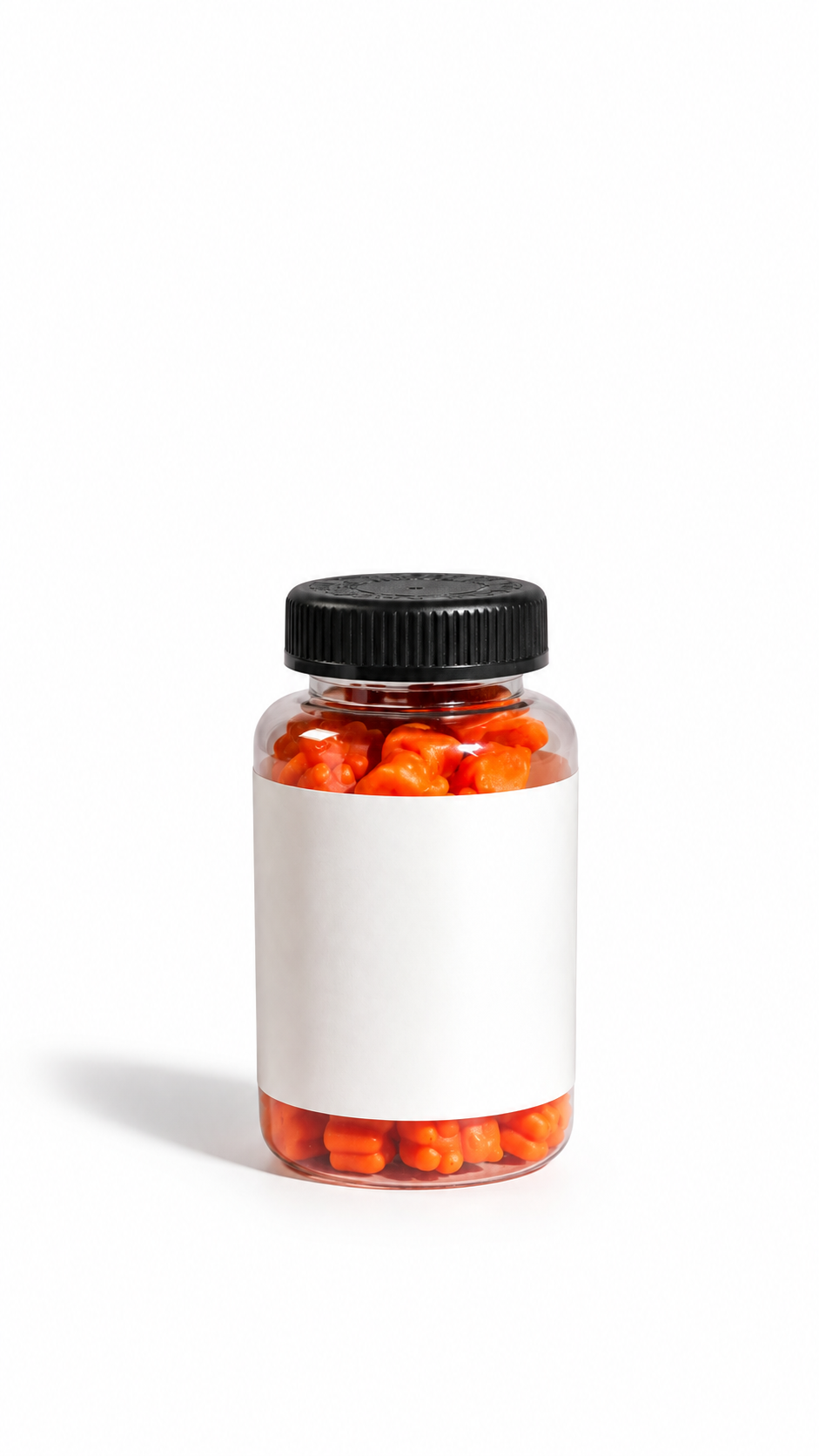 Clear supplement bottle filled with orange capsules